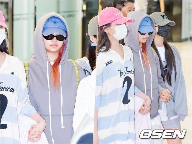 [OSEN=김포공항, 민경훈 기자] 28일 오전 그룹 아이브(IVE) 멤버들이 일본 앨범 프로모션 일정 행사 참석을 마치고 서울 김포국제공항을 통해 귀국했다. 아이브 레이가 리즈, 이서와 손을 꼭 잡고 멤버들과 함께 입국장을 나오고 있다. 2023.05.28 / rumi@osen.co.kr