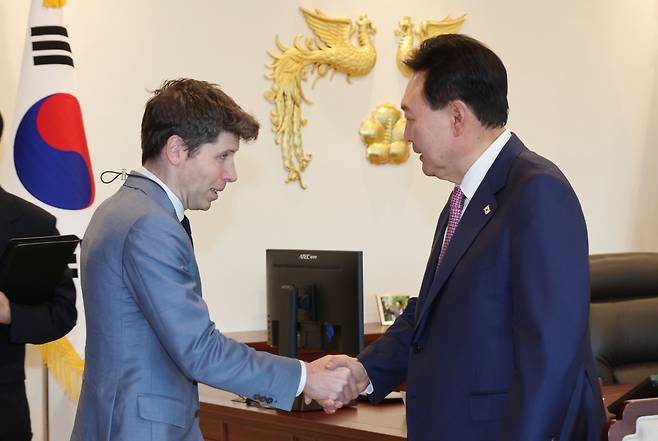 President Yoon Suk Yeol greets Open AI CEO Sam Altman at the presidential office in Yongsan-gu, Seoul, on Friday. (Yonhap)