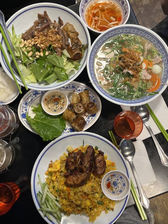 An assortment of Vietnamese dishes at a restaurant in Sinchon, western Seoul [SOFIA DEL FONSO]