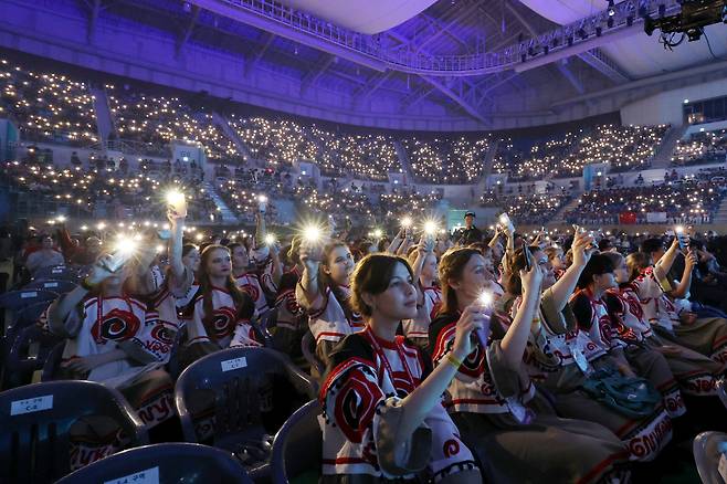 Members of Ukrainian girls' choir Vognyk participate in the opening ceremony of the 12th World Choir Games in Gangneung Arena on Monday. (WCG 2023 Gangneung Organizing Committee)