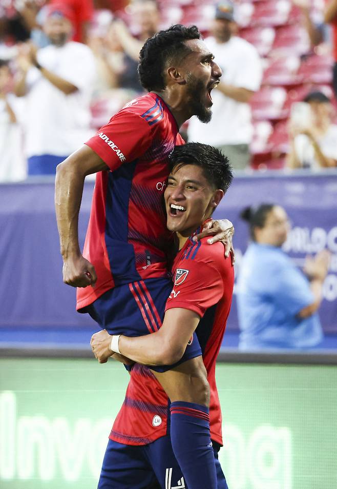 Jun 7, 2023; Frisco, Texas, USA;  FC Dallas defender Marco Farfan (4) celebrates with FC Dallas forward Jesus Ferreira (10) after scoring a goal during the second half against St. Louis City at Toyota Stadium. Mandatory Credit: Kevin Jairaj-USA TODAY Sports