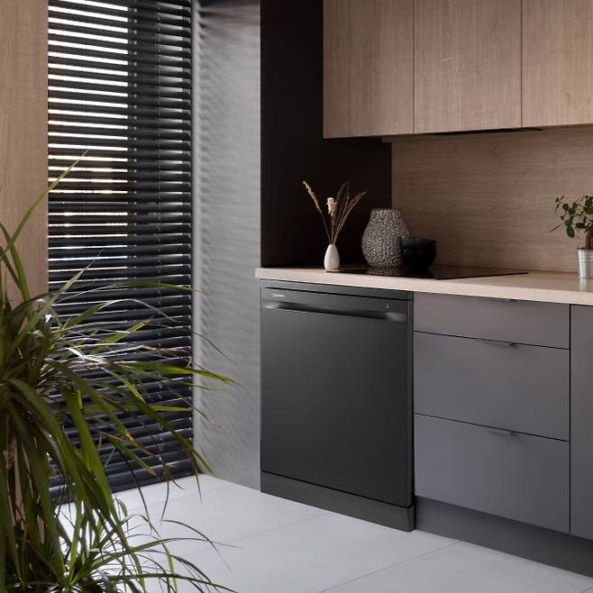 Modern kitchen with black and wooden furniture and big window with black blinds