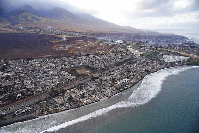 Wildfire wreckage is shown Thursday, Aug. 10, 2023, in Lahaina, Hawaii. The search of the wildfire wreckage on the Hawaiian island of Maui on Thursday revealed a wasteland of burned out homes and obliterated communities as firefighters battled the stubborn blaze making it the deadliest in the U.S. in recent years. (AP Photo/Rick Bowmer)