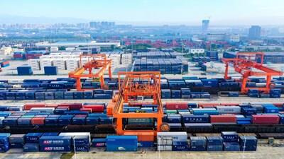 An aerial view of cranes working  at the bustling Chengdu International Railway Port.