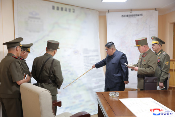 North Korean leader Kim Jong-un points the map of the Korean Peninsula during his visit to the North Korean military command post exercise. The location that Kim is pointing to is believe to be Gyeryongdae, a military complex that houses all three headquarters ? the army, navy and air force. [KOREAN CENTRAL NEWS AGENCY]