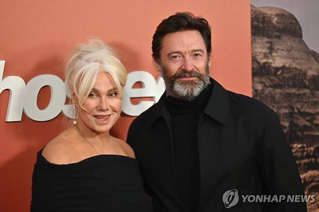 (FILES) Australian actress Deborra-Lee Furness (L) and Australian actor Hugh Jackman arrive for the "Ghosted" premiere at AMC Lincoln Square Theater in New York City on April 18, 2023. September 15, the Australian couple, who have two children, Oscar, 23, and Ava, 18, have been married for 27 years and are now separating. (Photo by ANGELA WEISS / AFP)