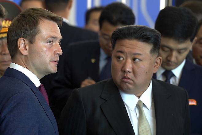 In this photo released by the Government of the Russian Far Eastern region of Primorsky Krai on Sunday, North Korea's leader Kim Jong-un (right) listens to Russian Minister of Natural Resources and Ecology Alexander Kozlov while visiting the Far Eastern Federal University in the Russky Island in Vladivostok, Russian Far East. (Government of the Russian far eastern region of Primorsky Krai via AP)