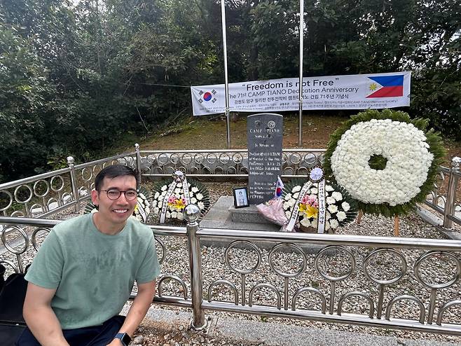 Merz Panares Lim, a bereaved family member of Lt. Apollo Tiano, poses for a photo next to the Camp Tiano War Memorial during a commemoration ceremony in Yanggu-gun, Gangwon Province, Monday. (Courtesy of Jenny Yoon)