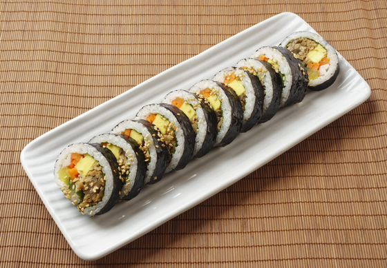 Gimbap in Korea come in various combinations of fillings wrapped in a layer of rice and gim, or dried seaweed. [SHUTTERSTOCK]