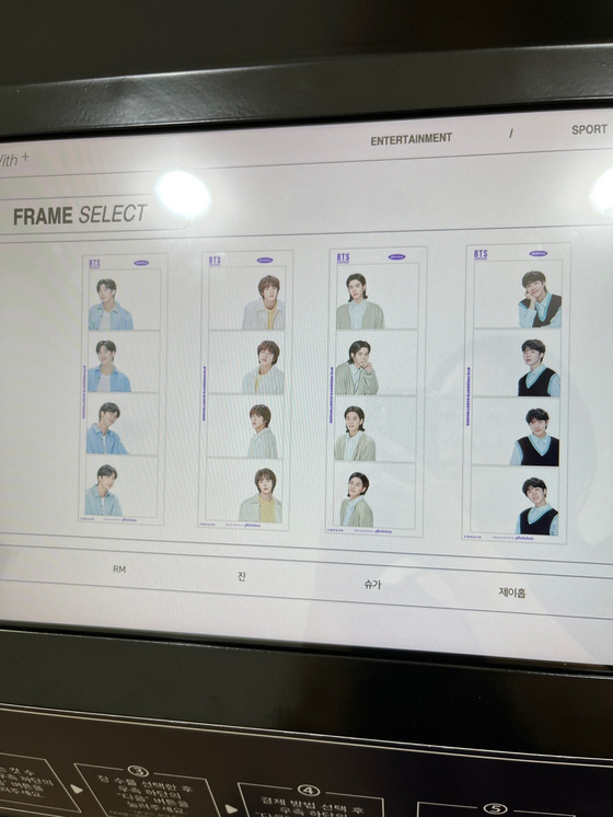 A Photoism booth in Sinchon offers “Artist Frames,″ which allow users to take a photo with BTS members as if they are right next to them using specially designed photo frames. [CHLOE PUI YING SAVANNAH YU]