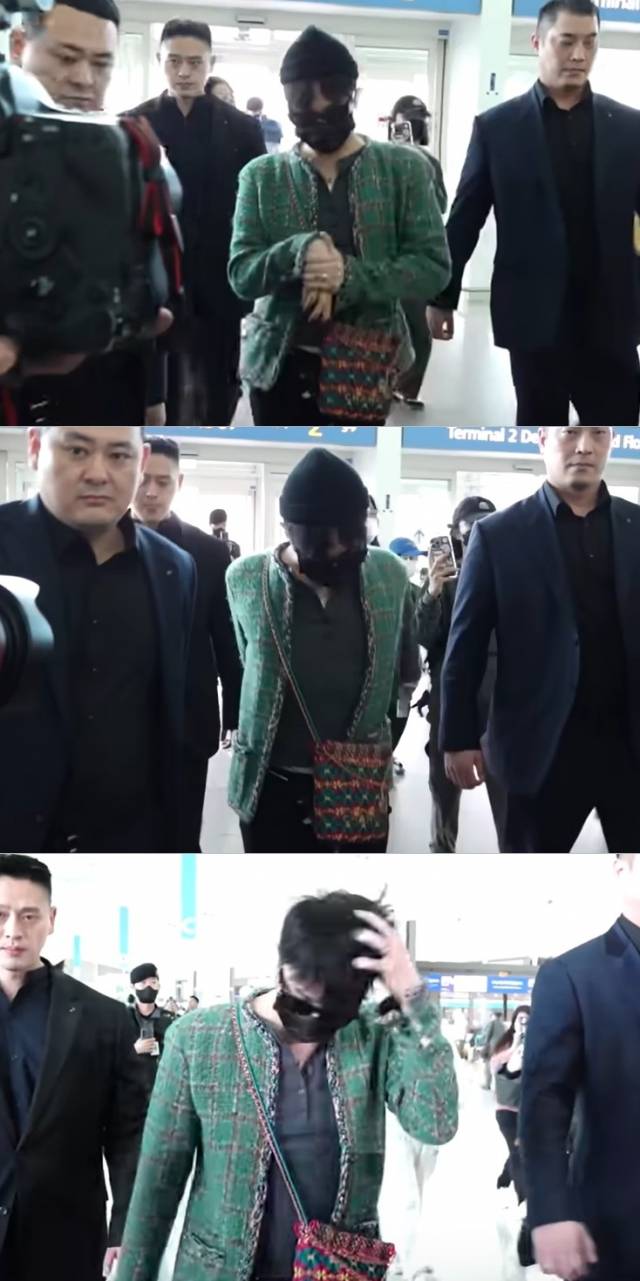 지드래곤이 지난 5월 8일 인천국제공항을 통해 출국하는 모습. 손을 가만히 두지 못하고 반복적으로 몸을 꼬거나 스트레칭을 하는 모습이 보인다. 유튜브 뉴스엔 계정 캡처