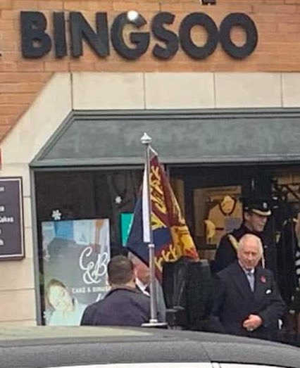 Charles walks out of a Korean dessert shop in New Malden, England, on Wednesday. [COLIN CROOKS TWITTER]