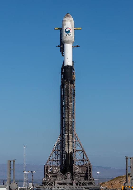 SpaceX's Falcon 9 rocket with South Korean reconnaissance satellite mounted is raised for liftoff at the Vandenberg Space Force Base in California.[MINISTRY OF DEFENSE]