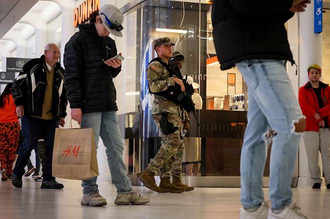 FILE PHOTO: Members of the New York National Guard patrol the Shops at the Oculus and Westfield Shops during Black Friday shopping in New York City, U.S., November 24, 2023.  REUTERS/Brendan McDermid/File Photo