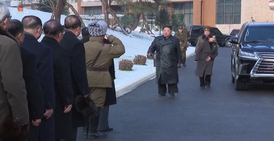 Kim Jong-un stands next to a vehicle with a Lexus logo during his visit to Yangdok Hot Spring Cultural Recreation Center, in images carried by North Korea’s state-run media, Korean Central News Agency, on Dec. 8, 2020.  [KOREAN CENTRAL NEWS AGENCY]