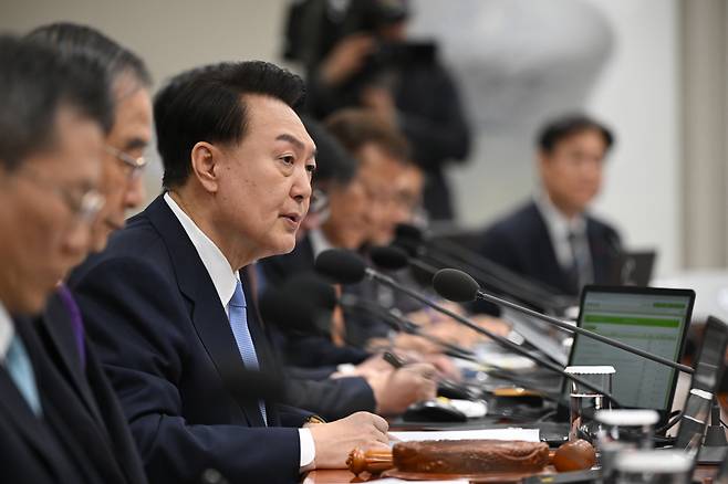 President Yoon Suk Yeol (third from left) speaks during a Cabinet meeting in his office in Seoul on Tuesday. (Yonhap)