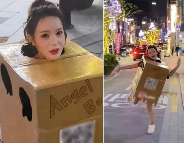 서울 압구정동 거리에서 박스만 걸친 채 길거리를 돌아다니는 한 여성이 포착돼 화제를 모으고 있다. 인스타그램 갈무리