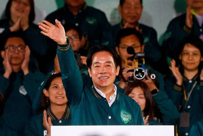 Taiwan President-elect Lai Ching-te, of Democratic Progressive Party's gestures as he attends a rally following the victory in the presidential elections, in Taipei, Taiwan on Jan. 13. (Reuters-Yonhap)