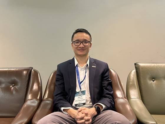 Alex Yu, founder and chief technology officer at Factorial Energy, takes a photo during an interview with the Korea JoongAng Daily on the sidelines of InterBattery 2024 in Coex, southern Seoul on Thursday. [SARAH CHEA]
