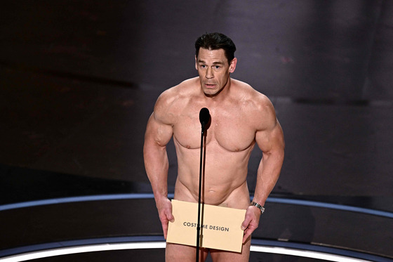 TOPSHOT - US actor John Cena presents the award for Best Costume Design onstage during the 96th Annual Academy Awards at the Dolby Theatre in Hollywood, California on March 10, 2024. (Photo by Patrick T. Fallon / AFP)  〈저작권자(c) 연합뉴스, 무단 전재-재배포, AI 학습 및 활용 금지〉