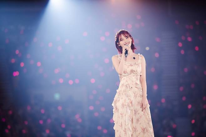 IU performs at the final Seoul concert of her first world tour, "H.E.R," at the KSPO Dome in Seoul on Sunday. (Edam Entertainment)