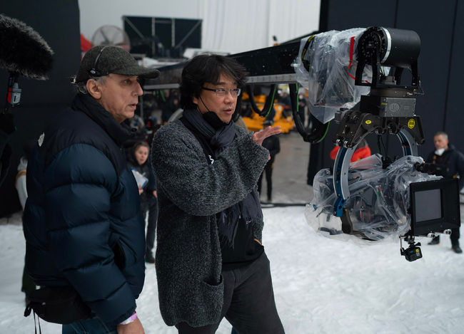 "Mickey 17" cinematographer Darius Khondji (left) and director Bong Joon-ho are seen during the production of "Mickey 17" in London. (Warner Bros. Pictures)