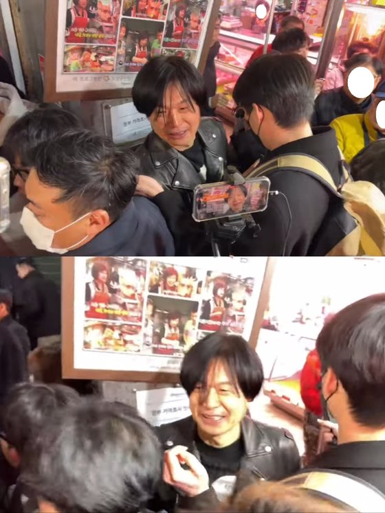 지난 7일 수원 지동못골시장에서 일부 유튜버들과 지지자들에 둘러싸인 주진우씨. 사진 유튜버 캡처