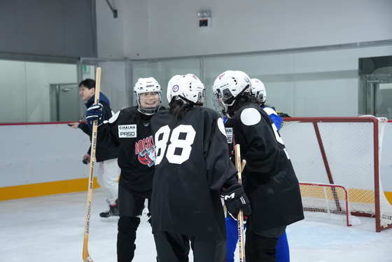 Mary celebrates with her team after someone (not her) scores a goal. [KIM HYUNG-JU]