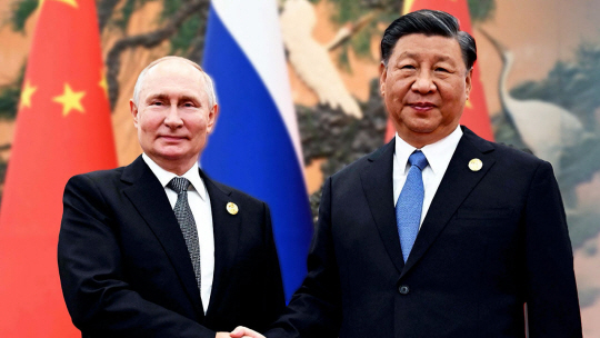 지난해 10월 베이징서 만난 시진핑과 푸틴. 타스 연합뉴스