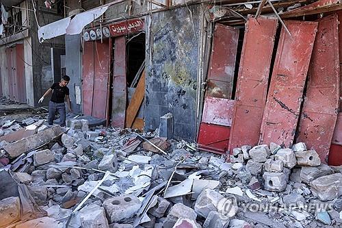 이스라엘군 폭격으로 파괴된 라파의 건물 [AFP=연합뉴스 자료사진. 재판매 및 DB 금지]