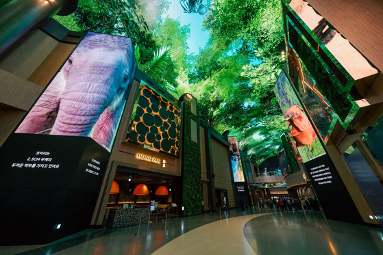 Campaign video jointly created by the World Wide Fund for Nature (WWF) and Mohegan Inspire Entertainment Resort in Yeongjong Island, Incheon plays on the resort's 150-meter-long digital street Aurora. [MOHEGAN INSPIRE ENTERTAINMENT RESORT]