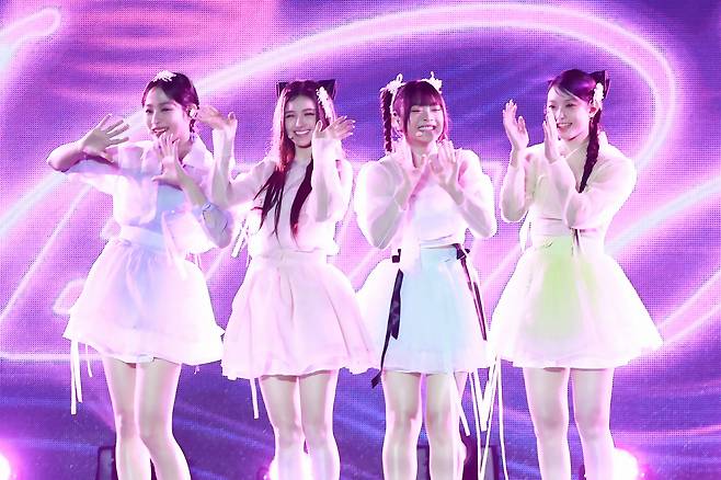 K-pop girl band NewJeans participates at the 2024 Visit Korea Heritage Campaign & Korea On Stage event held at Gyeongbokgung in central Seoul on Tuesday. (Yonhap)