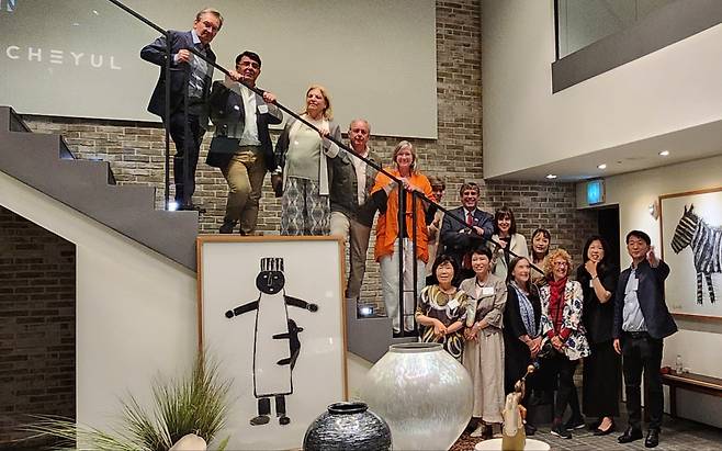 Guests pose for a photo after a tour at Cheyul’s flagship in Sinsa-dong, Seoul. (Choi Si-young/The Korea Herald)