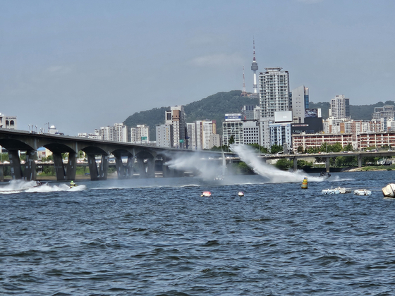 Jet skis join us on the water in Yeouido, western Seoul. [SAILING PARADISE]