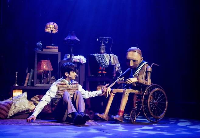 Changmin Shim plays Benjamin in the musical Benjamin Button. He sometimes manipulates the puppetized Benjamin to perform alongside him. Courtesy of EMK Musical Company