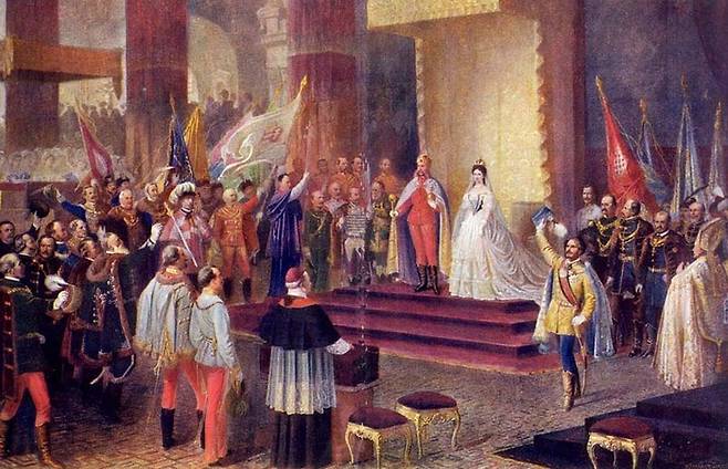 “오늘부터 우리는 헝가리의 왕과 왕비이기도 합니다.” 프란츠 요제프와 황후 시시가 오스트리아-헝가리 제국 출범을 기념해 헝가리의 왕과 왕비로 즉위하고 있는 장면.