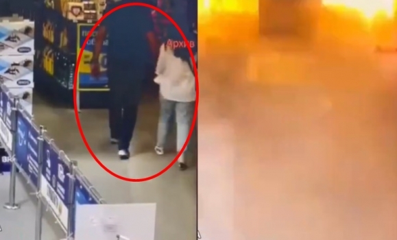 지난 25일 오후 하르키우의 가정용품 대형마트가 폭격을 받은 가운데, 한 남성과 소녀가 손을  잡고 걷는 모습이 내부 CCTV에 촬영됐다.