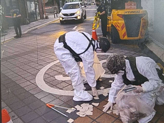 South Korean authorities collect trash dropped by North Korean balloons in the streets of Gangseo-gu, a southwestern district in Seoul, on Tuesday. (South Korea’s Joint Chiefs of Staff)