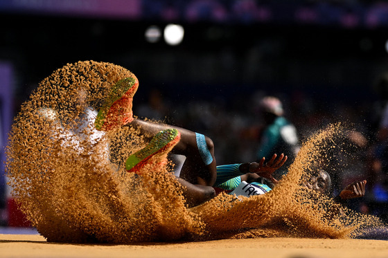 Charisma Taylor of the Bahamas competes in the women's triple jump qualification round at the Stade de France in Paris on Friday.  [AFP/YONHAP]