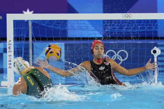 Canada's goalkeeper Jessica Gaudreault fails to stop a ball by Australia's Bronte Halligan during a women's water polo Group A preliminary match at the Paris Olympics on Friday in Saint-Denis, France. [AP/YONHAP]