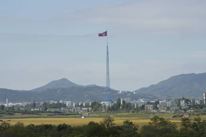 A North Korean flag waves in the wind near the border villages of Panmunjom in Paju, South Korea on Oct. 4, 2022. (File Photo - AP)