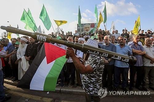 레바논 남부에서 열린 '이스마일 하니예 암살 규탄' 집회  [AP=연합뉴스 자료사진. 재판매 및 DB금지]