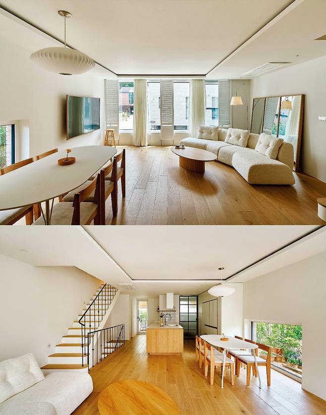 나뭇결이 살아 있는 무늬목 가구와 원목마루를 사용해 아늑하고 편안한 분위기를 내는 LDK형 거실. 운동 동작 촬영을 위해 세워둔 대형 거울이 실내를 더 넓어 보이게 하는 효과를 낸다.