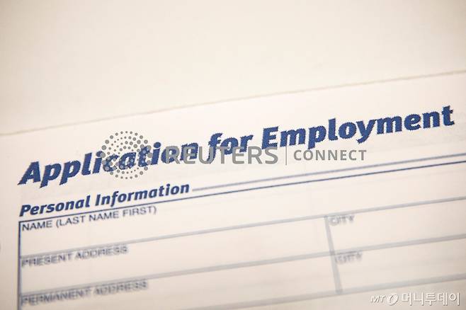 An employment application form is displayed during a restaurant job career fair organized by the industry group High Road Restaurants in New York City, U.S., May 13, 2021. REUTERS/Brendan McDermid