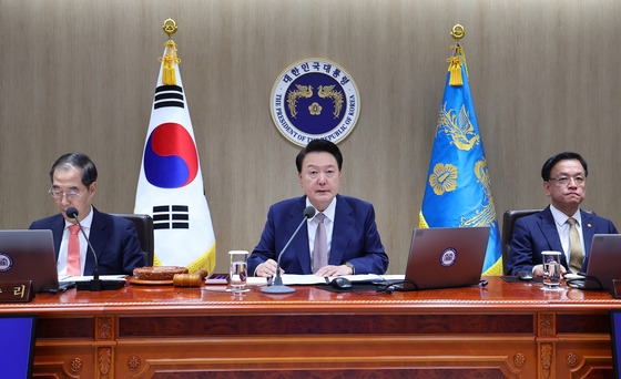 President Yoon Suk Yeol, center, holds a Cabinet meeting at the Yongsan presidential office in central Seoul on Tuesday. [JOINT PRESS CORPS]