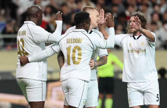 Yaya Toure, left, celebrates with his teammates after scoring the opening goal  [NEWS1]