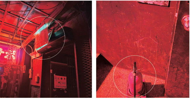 19일 오전 1시쯤 찾은 서울 마포구 ‘홍대 클럽거리’ 한 클럽에 비상구 표시등(사진 왼쪽)이 종이박스로 덮여 있다. 이 클럽 내부에서는 소화기를 찾을 수 없었는데 출입문 밖에 단 한 대가 놓여 있다.  조언 기자