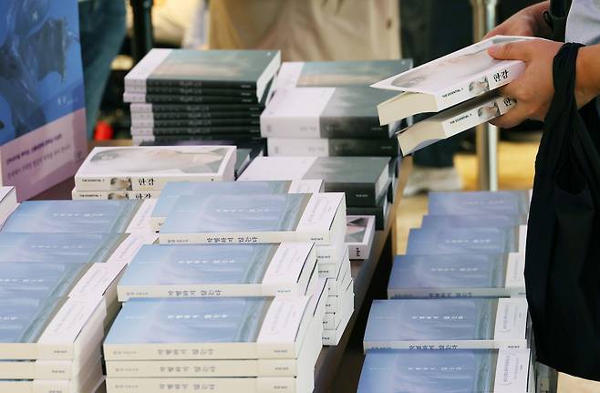 A person browses Han Kang's books at the Kyobo Bookstore in Gwanghwamun on Friday. (Yonhap)