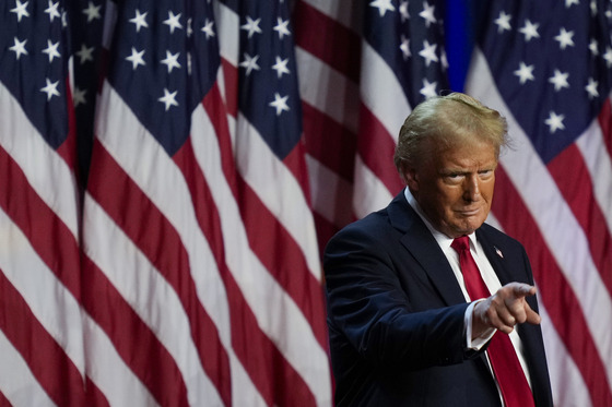 Republican nominee Donald Trump, the projected winner of the U.S. presidential race, points to the crowd at an election night watch party in West Palm Beach, Florida, on Wednesday. [AP/YONHAP]