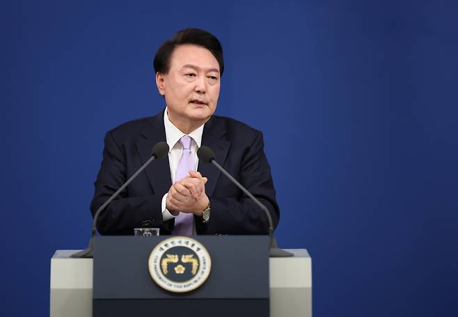 President Yoon Suk Yeol responds to press questions during a conference Thursday at the presidential office in Yongsan, Seoul. (Yonhap)